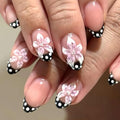 Medium Almond Press On Nails, Nude Pink Fake Nails with 3D Flower Design, Black French Tips and White Polka Dot Accents, Glossy Reusable Glue On Nails for Women Daily Wear Party, 24PCS - color: 3D-70-Pink Blossom Dots